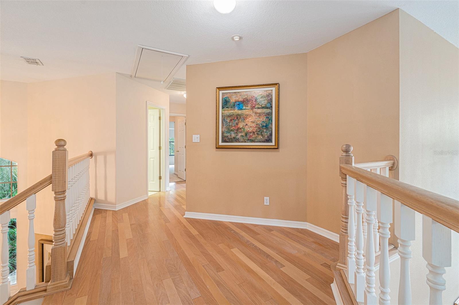 Beautiful wood floors lead to the upstairs bedroom and shine a light on your favorite piece of art or portrait