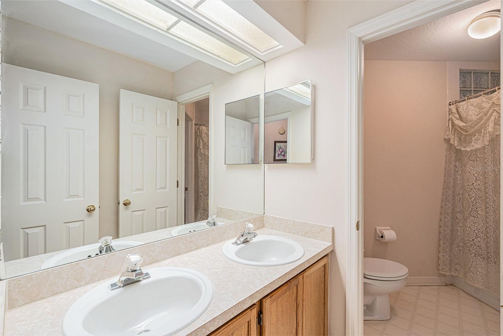 This full bathroom is shared by the upstairs bedrooms