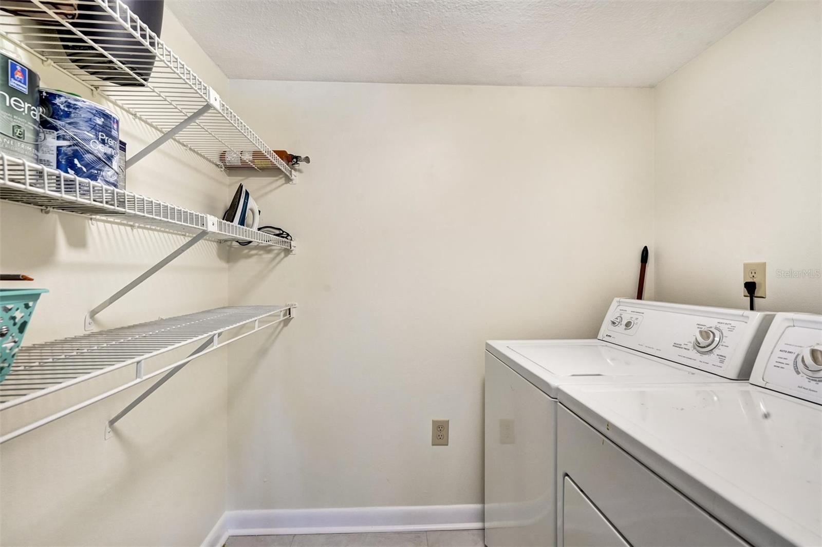 Laundry room with new flooring and light.