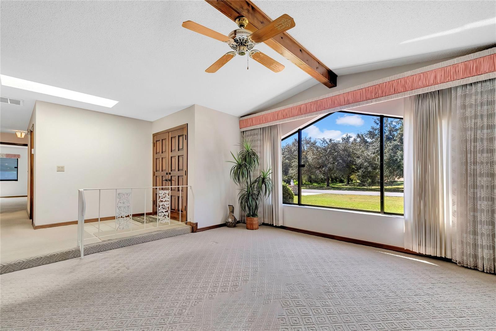 Living room with view of front entry