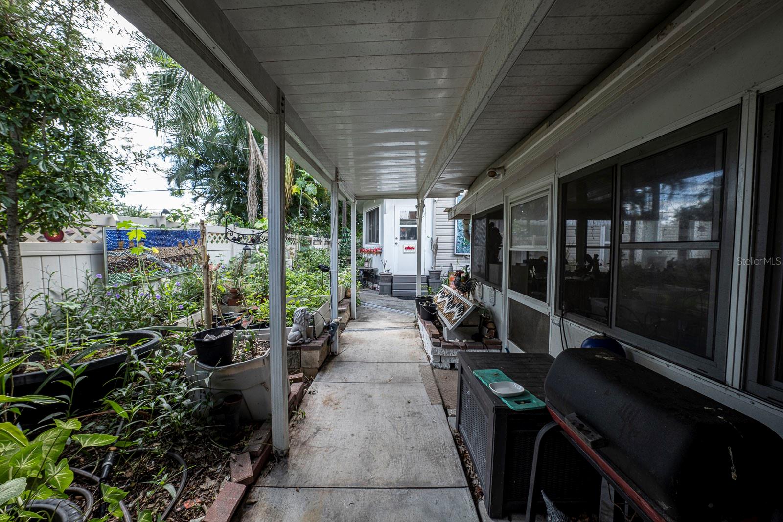 View from the side patio door. Pull into the carport adjacent to the patio and bring the groceries.