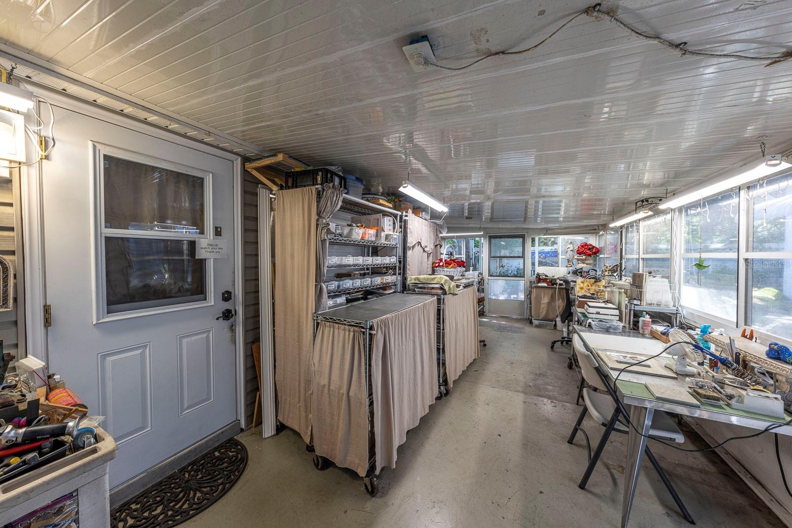 Back door leading to the home. Again, so much space in this enclosed patio.