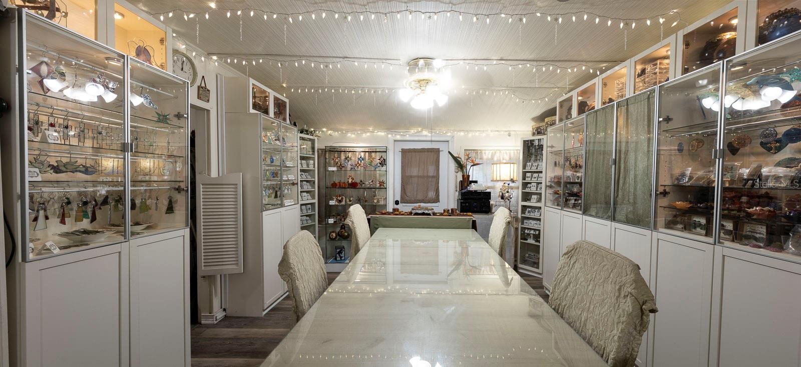 Dining room. Showing the large space as it accommodates cabinets on both sides as well as a large table.