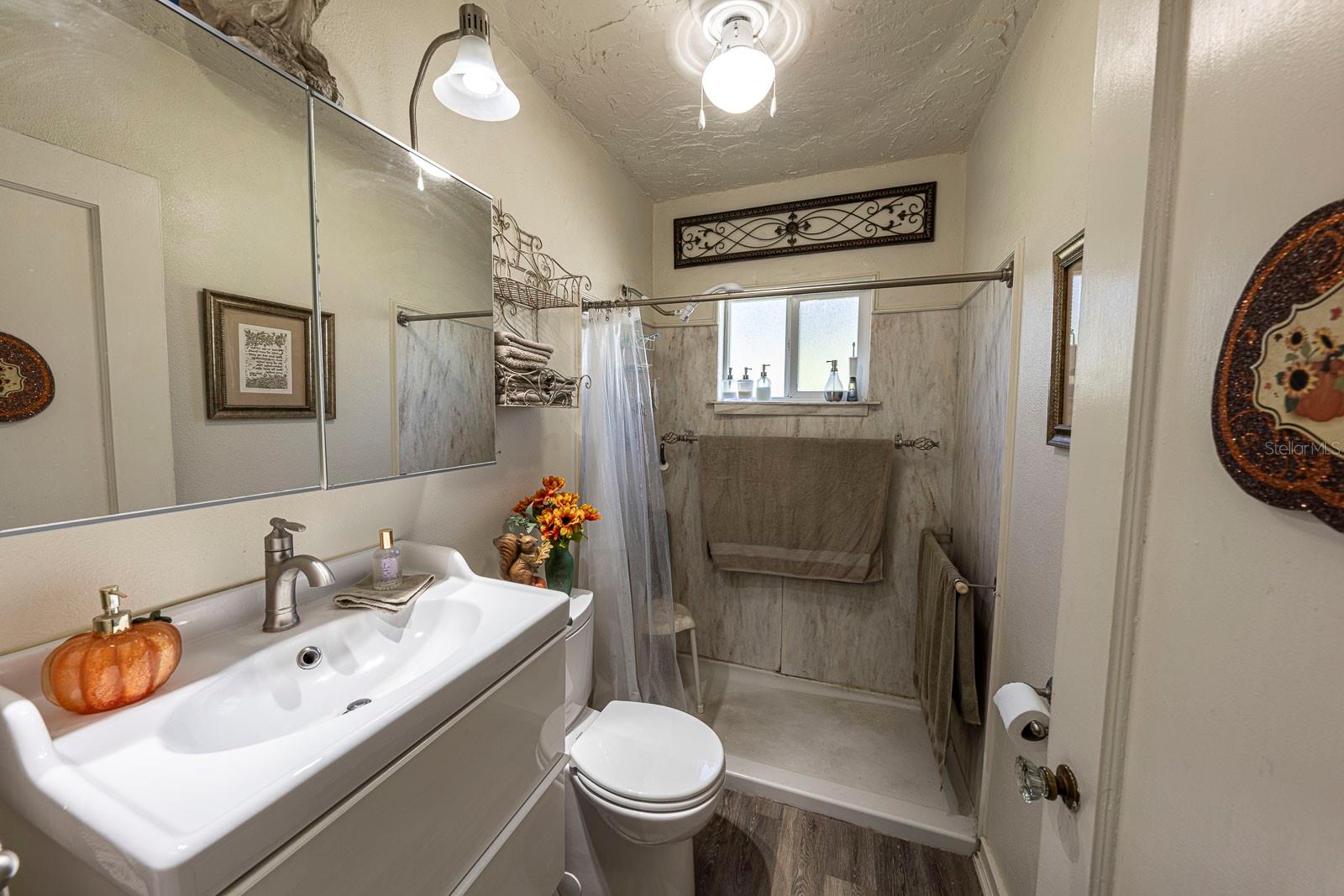 Remodeled bathroom with walk-in shower.