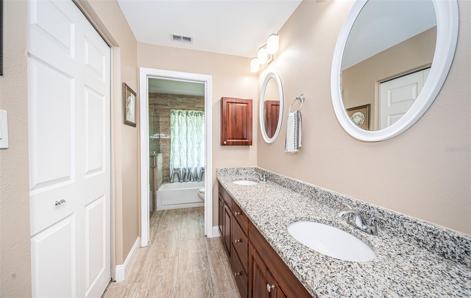 Double vanities and granite counter in primary bath