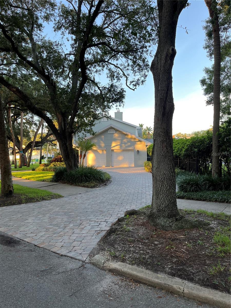 Oversized 2 car garage with paver driveway