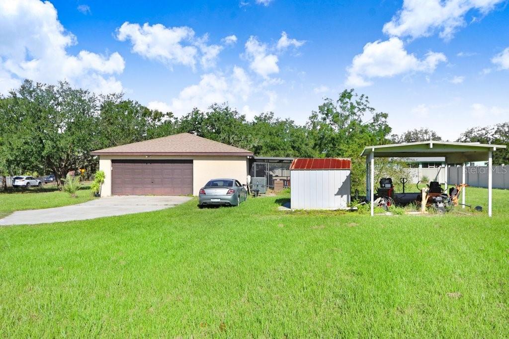 Garage and a covered space for lawn or small toys.