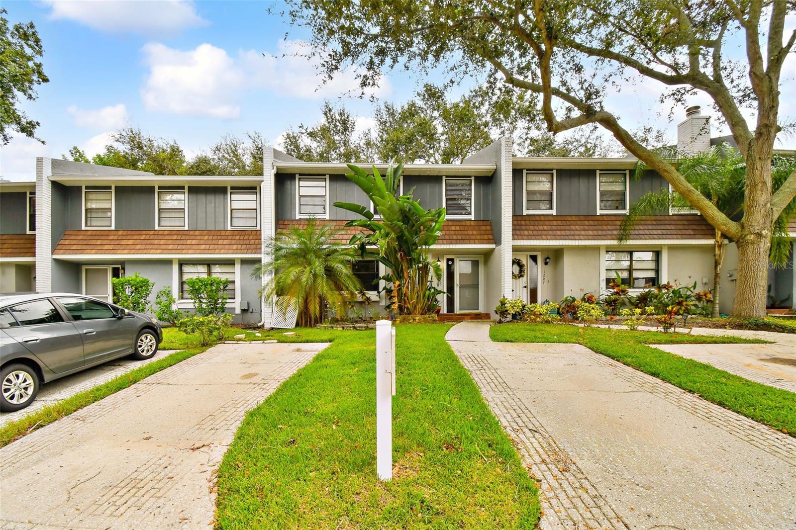 front building showing two designated parking pads in front og the home