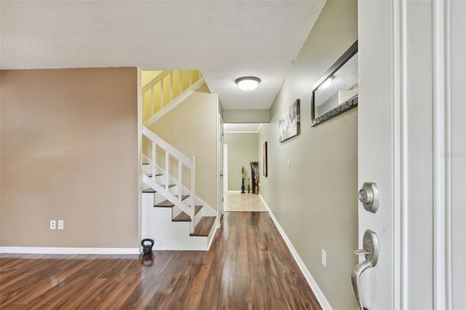 living room showing stairs leading to second floor