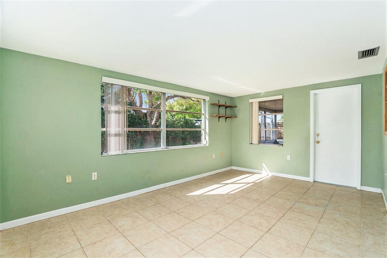 Large Florida room has been enclosed and can offer more space for another bedroom or office