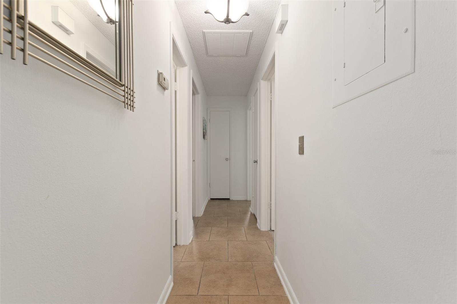 hallway, at the end to the left is the primary bedroom