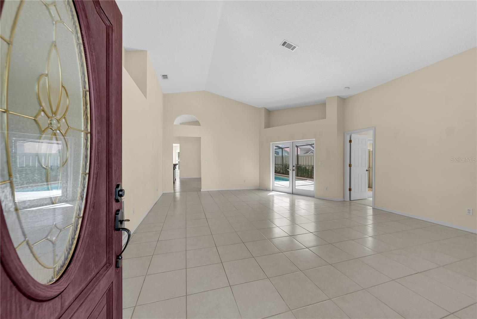 As you enter the front door, you will find an oversized living room with extra space for dining, a piano or game table.