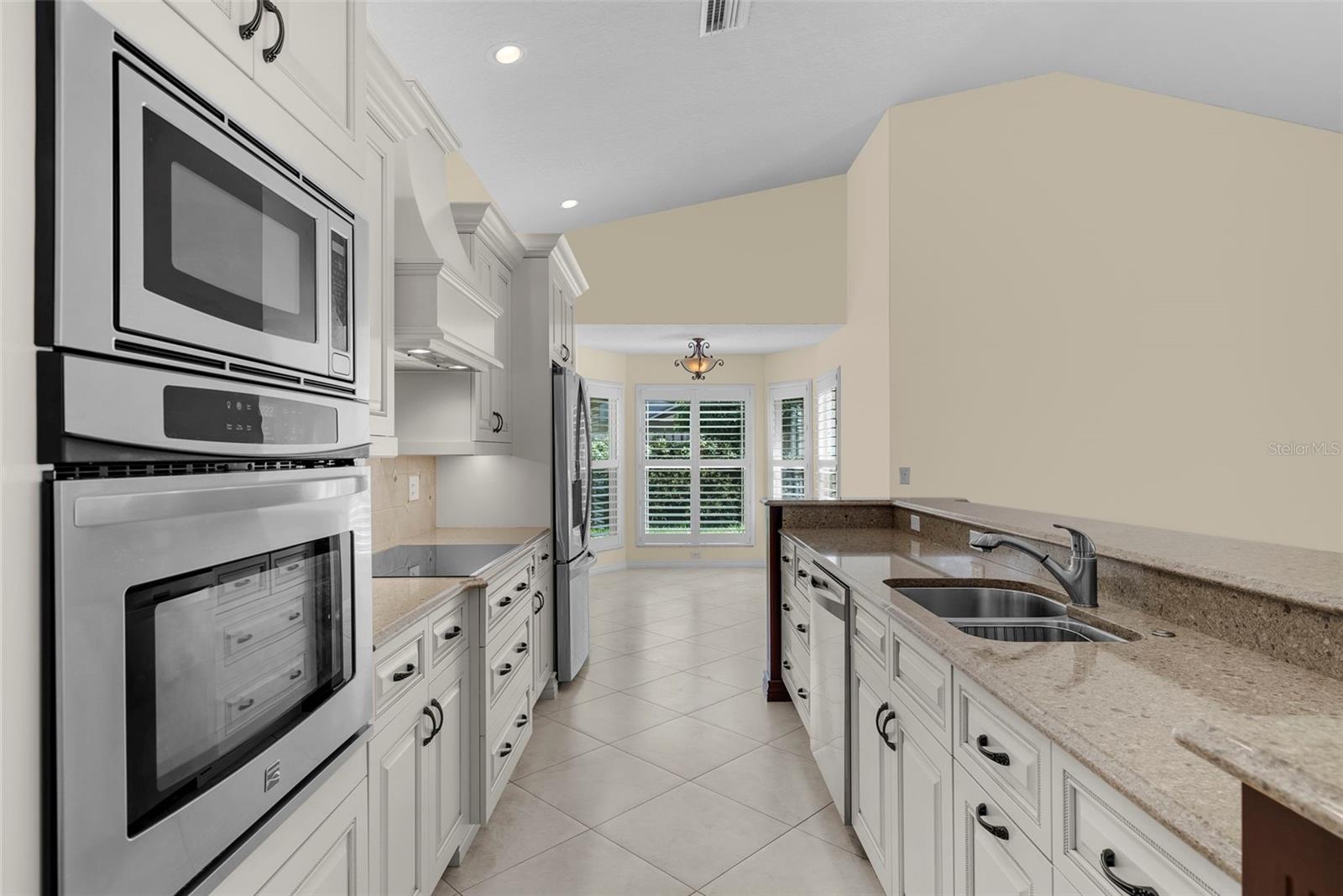 The large kitchen has space for a large dining room table and separate dinette.