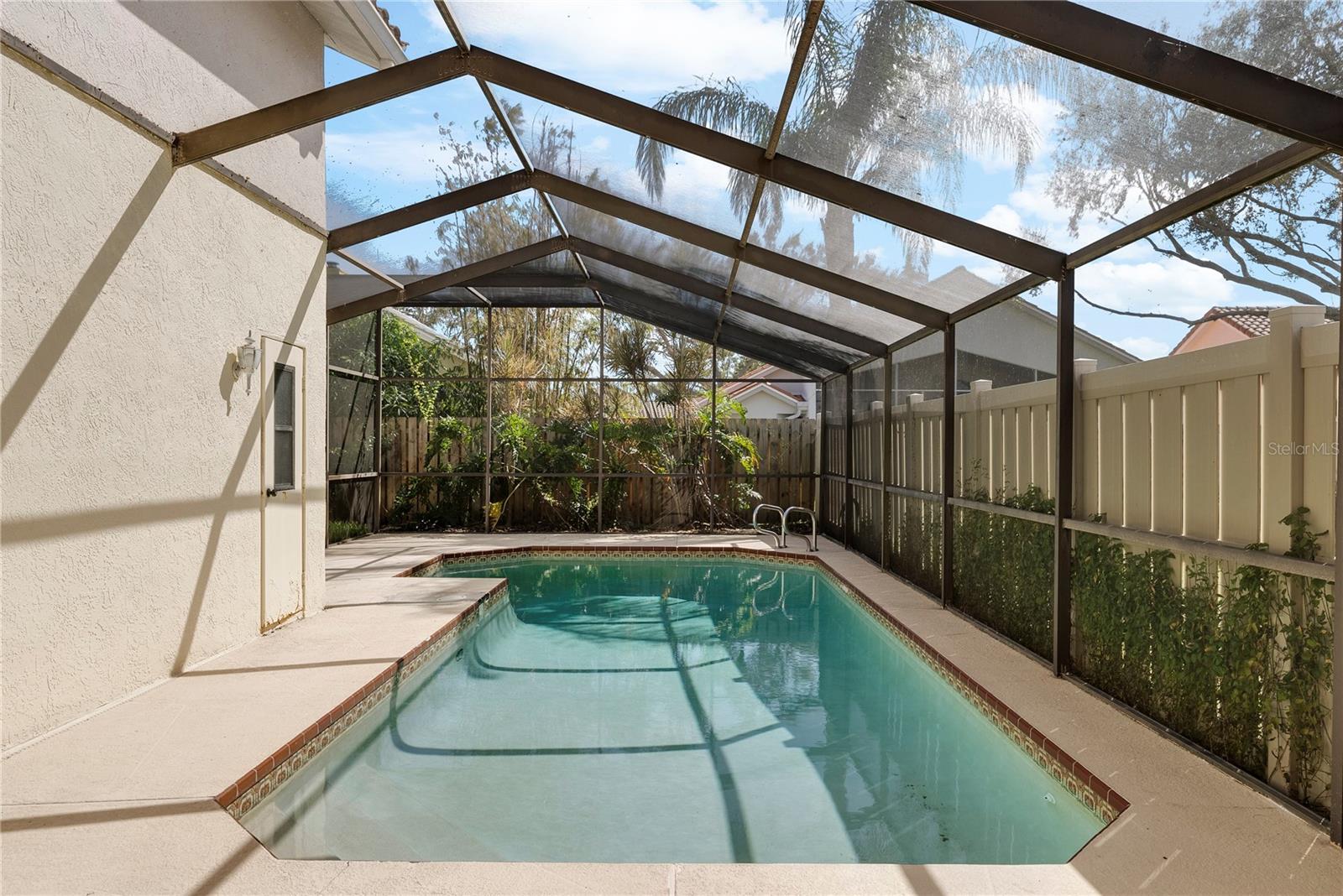 Chlorine pool with a screened lanai.