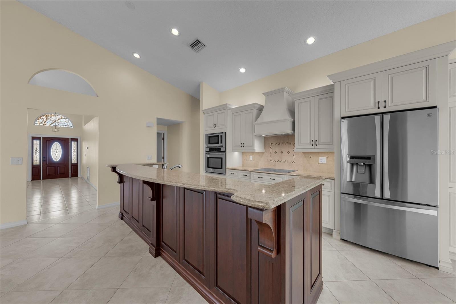 Volume ceilings in the kitchen and front living room add an airy element to the home.