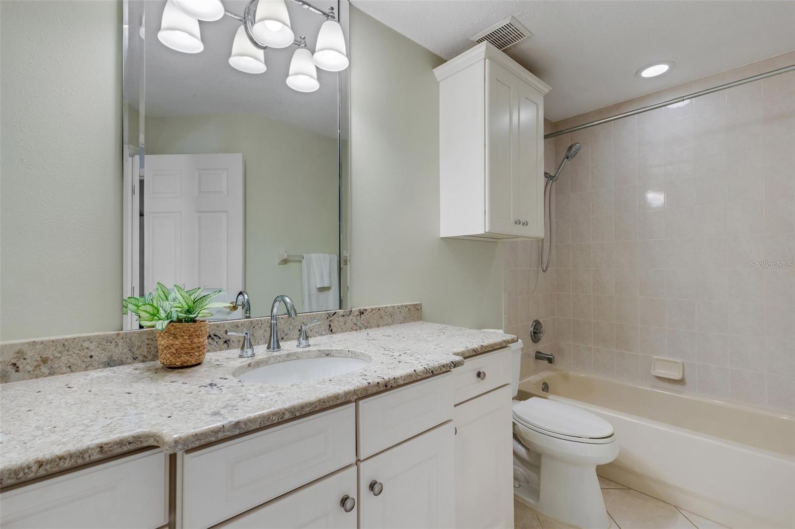 Beveled mirror and granite counter in the hall bathroom!