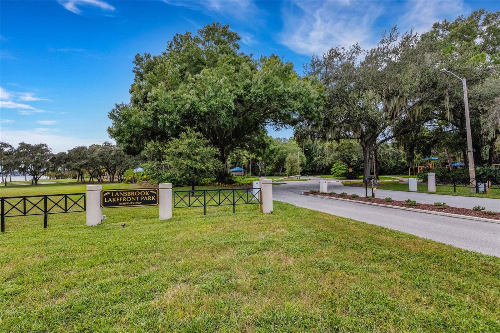 Lakefront Park with residents-only access to the boat ramp to Lake Tarpon, walking trails and playground!