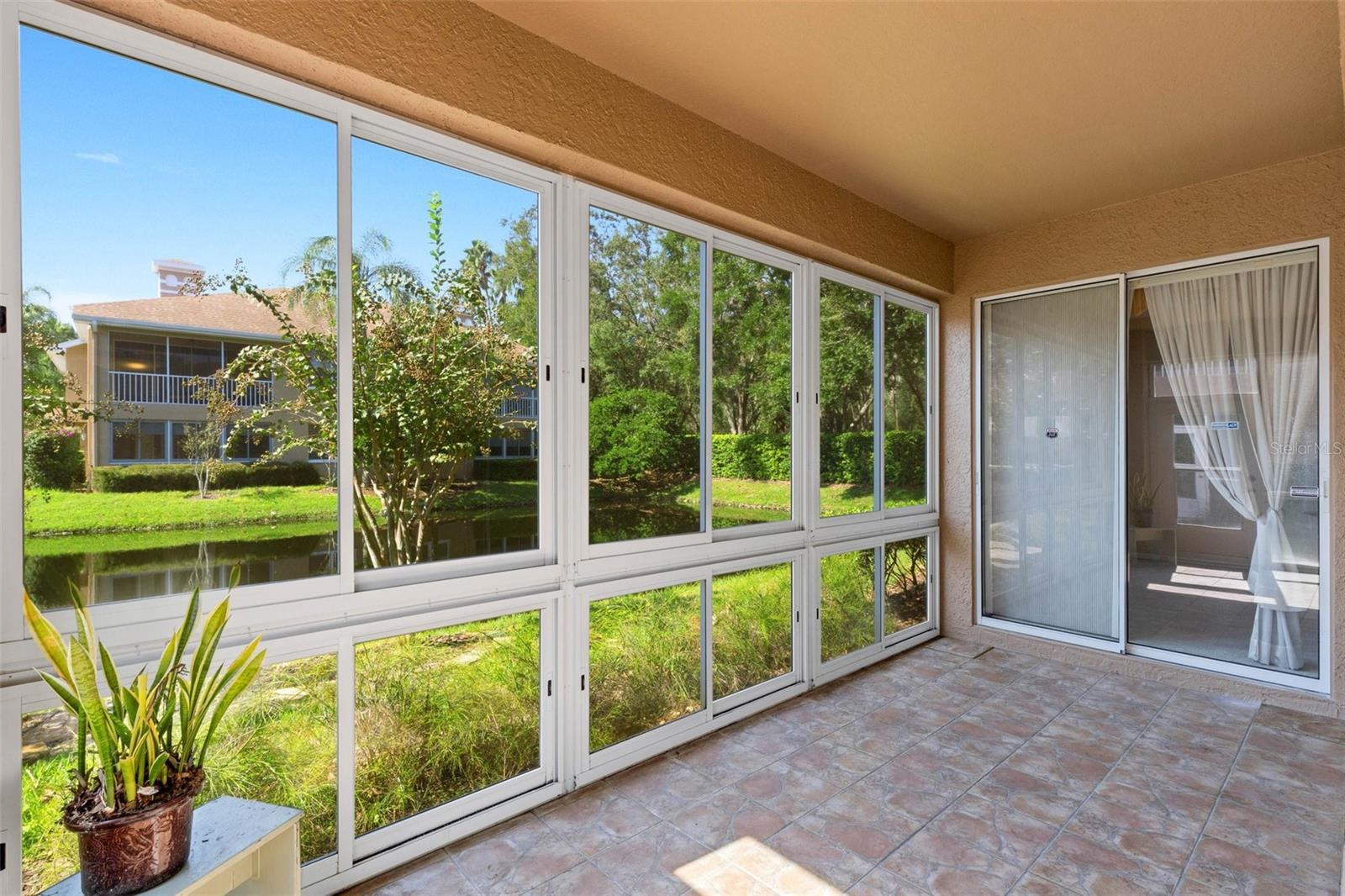 Lanai overlooks the pond, and is accessible through sliders from LR and primary bedroom!