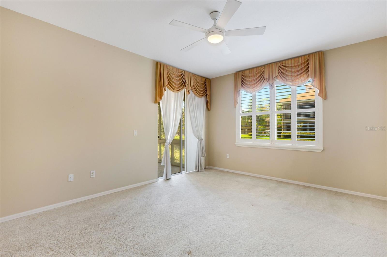 Primary bedroom with slider to lanai!