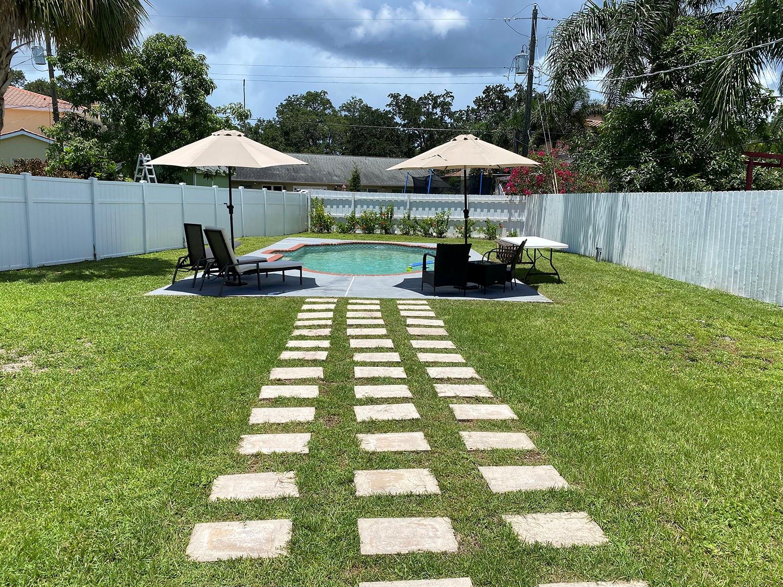 Pre-flood image of the backyard and pool area.