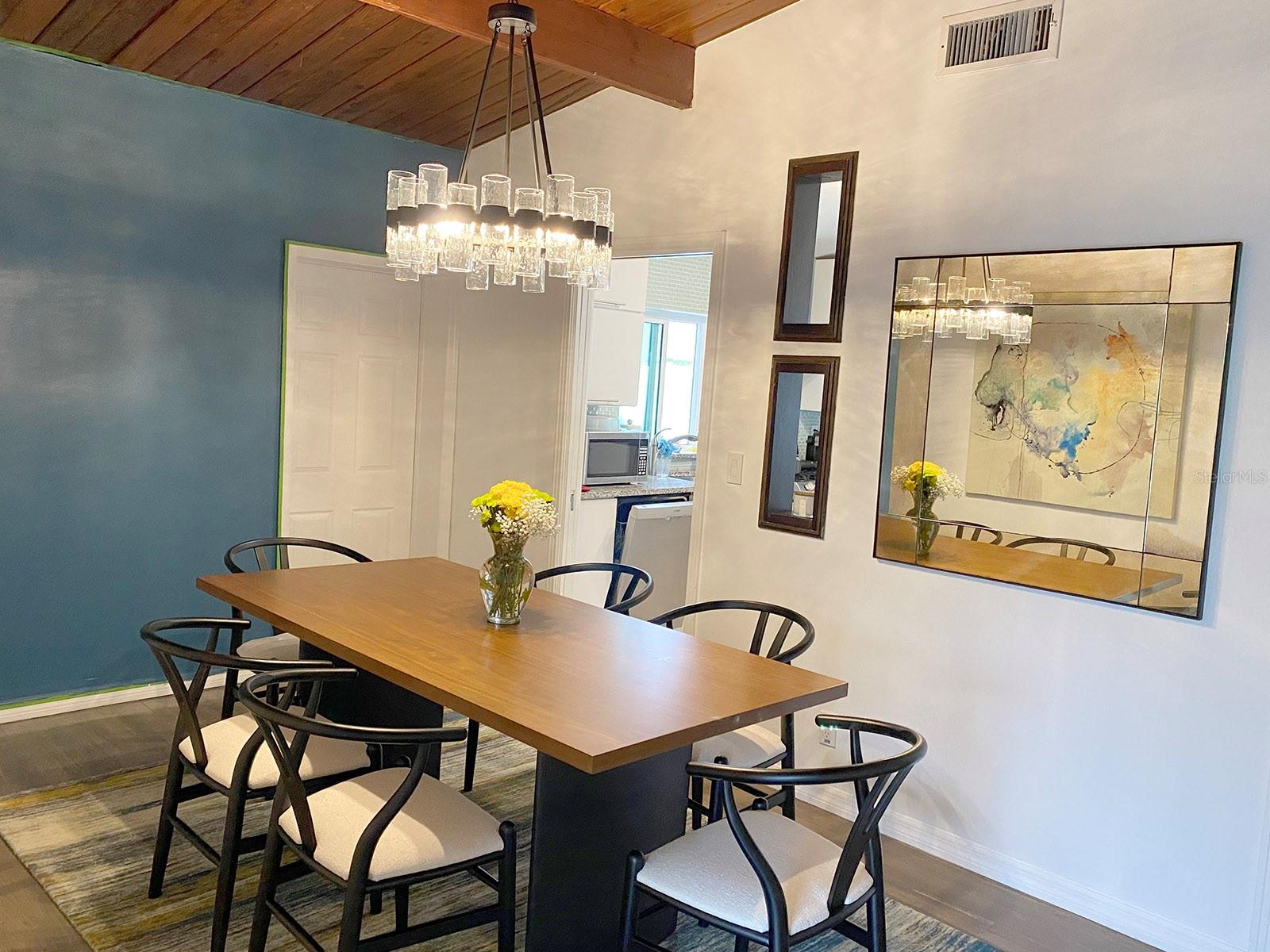 Pre-flood image of the interior for reference. This is the dining near the front entry to the home.