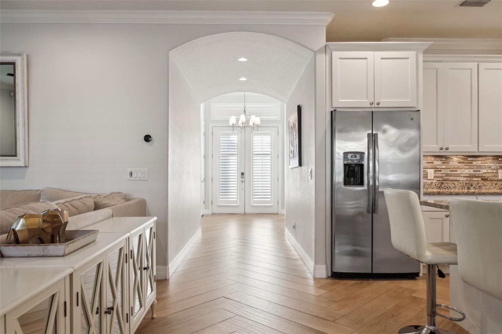 foyer leads to living/dining/kitchen