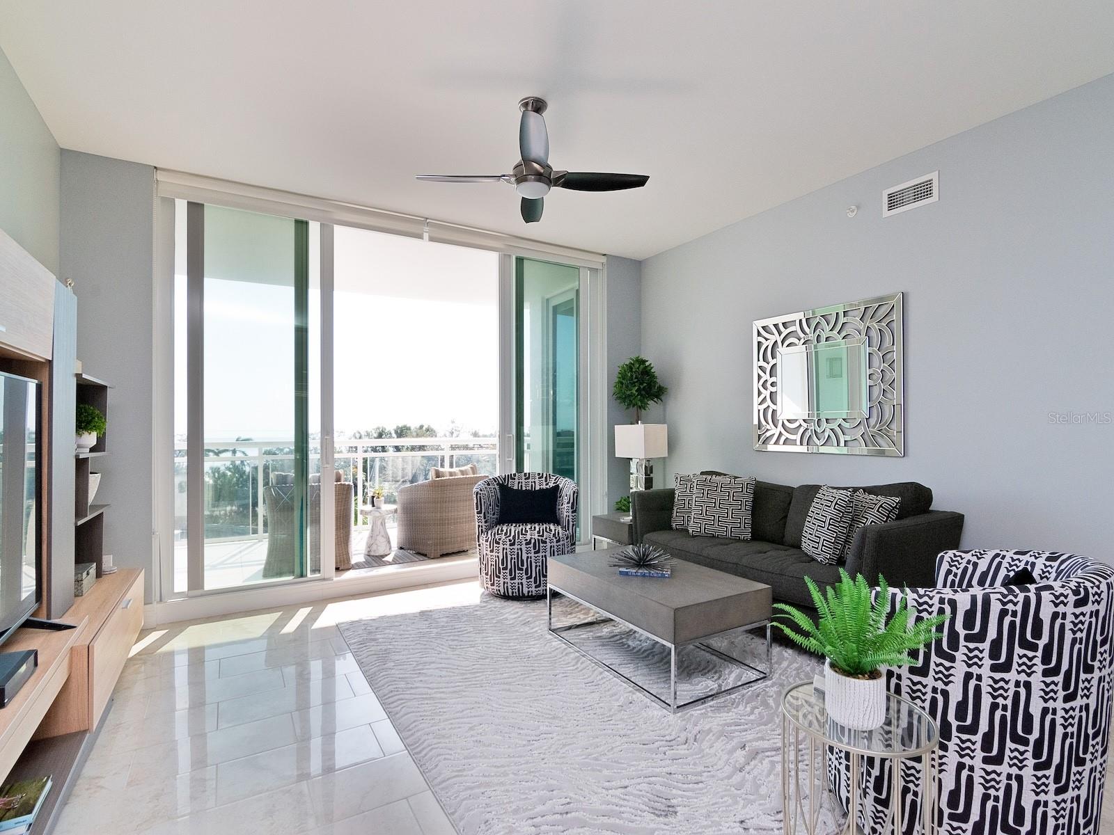 Family Room w/wall to ceiling patio doors