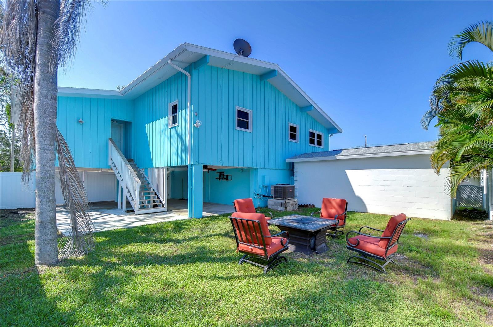 We currently have a fire pit area here. but you can get so creative with picnic tables, a mural on the storage shed (white building attached) and make it really something special!