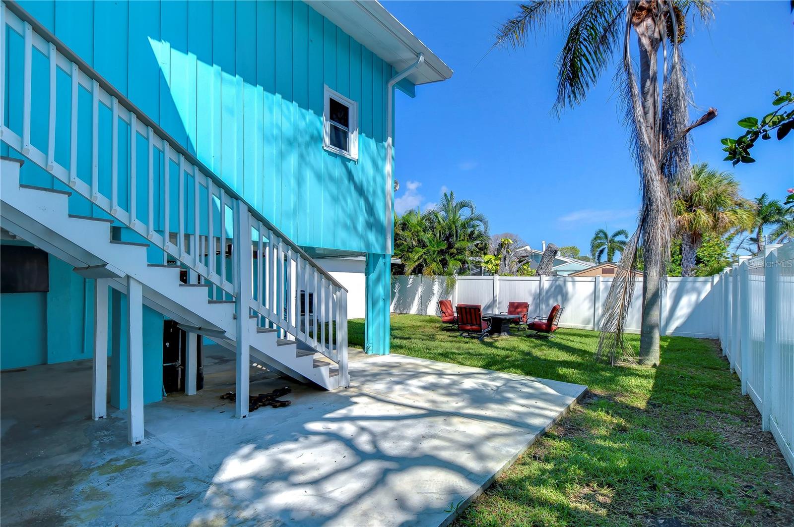 This is the "right" side of our backyard space. The stairs do go directly up to a bedroom area.