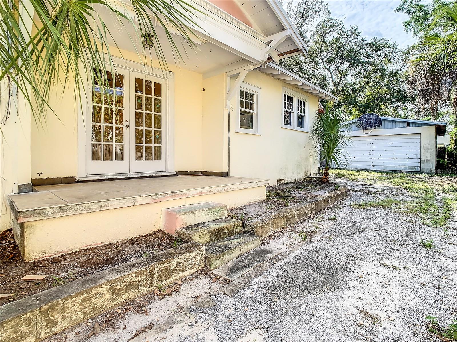 Side porch - private drive - detached garage