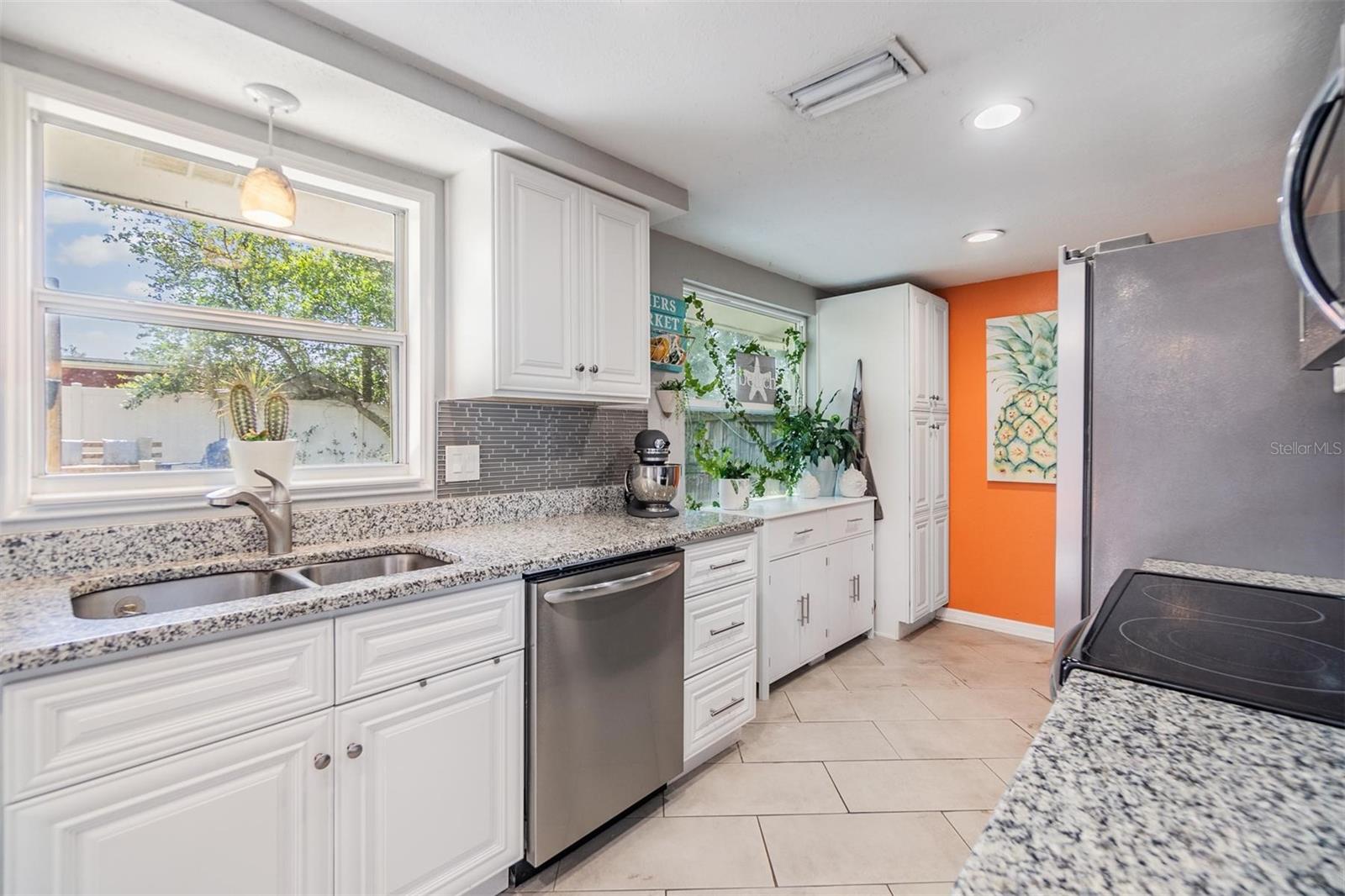 With a window over the kitchen sink it allows views to the beautiful back yard and lets lots of natural light in.