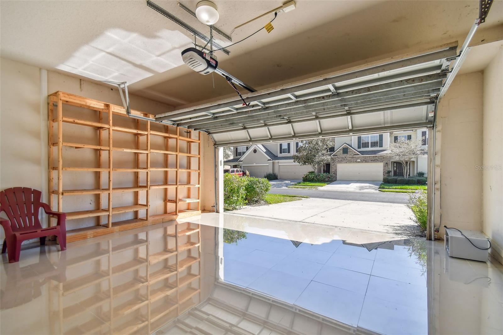 Garage with Tile Floors and Storage Shelves