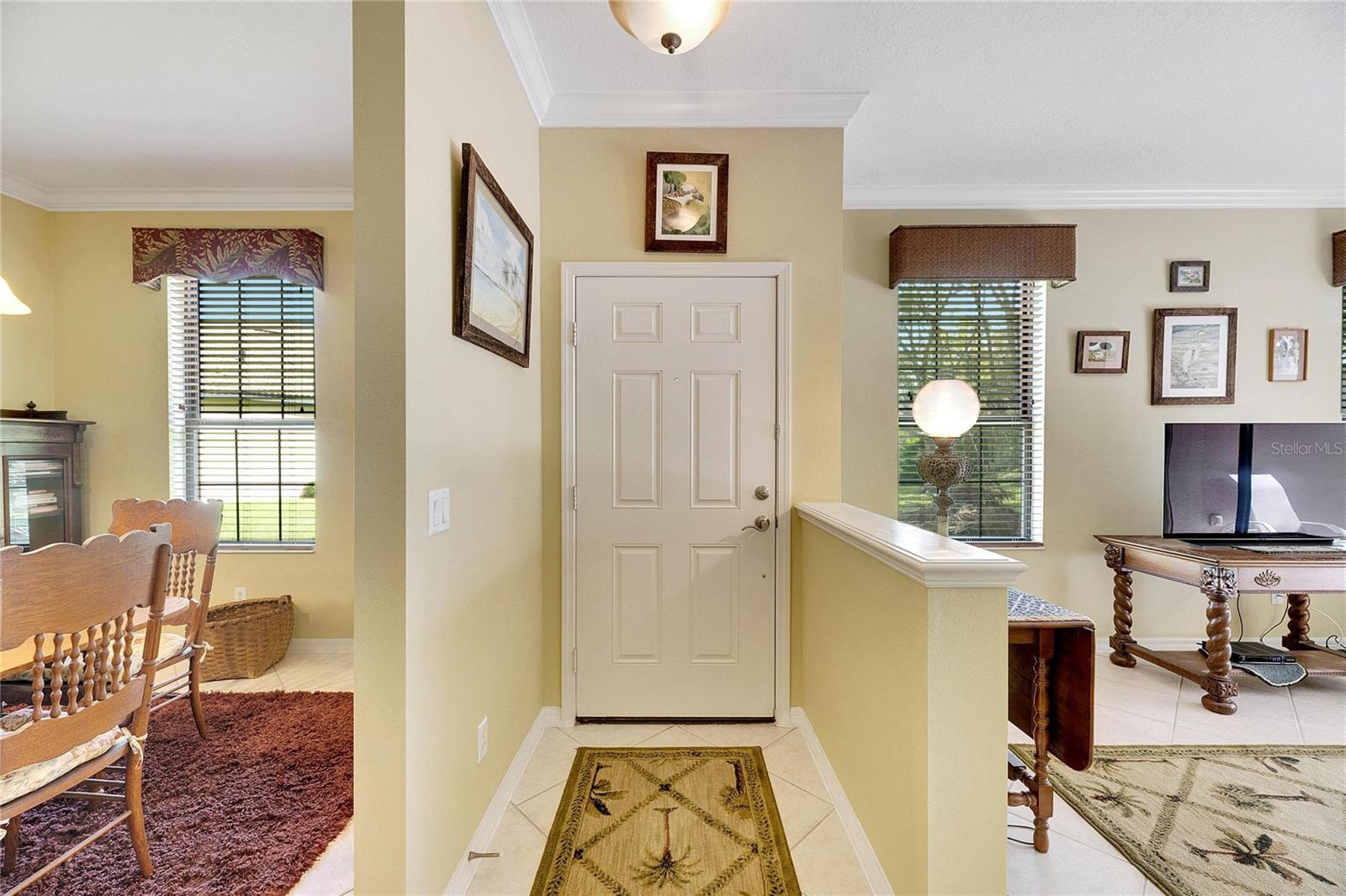 Dining room on left, living room on right with front entrance in middle