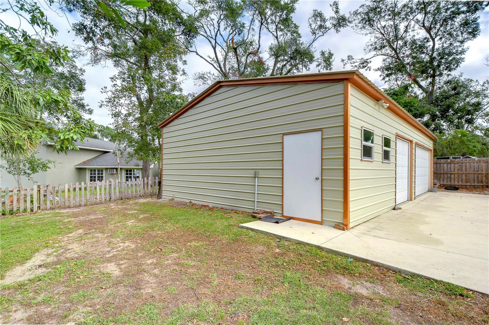 Complete with 100-amp electric, LED lighting system, commercial-grade heavy-duty shelving, and convenient separate entry “man door”!