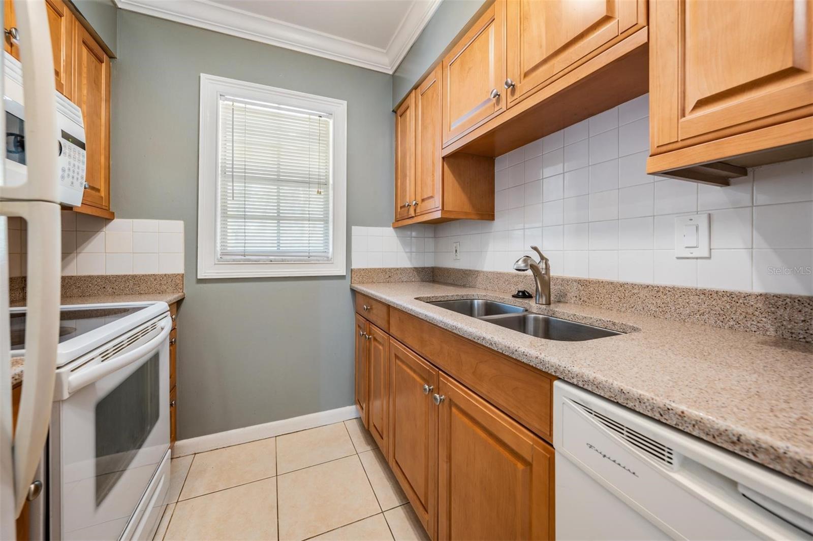 HUGE window overlooking courtyard giving your kitchen LOTS of natural light!