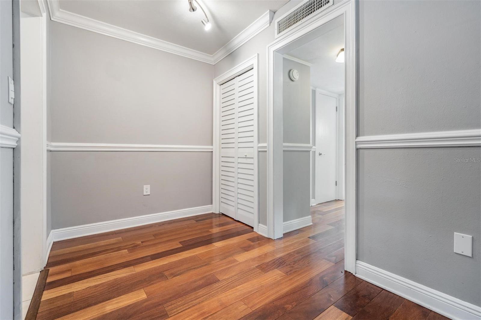 Hallway leading to bedroom and bathroom.  In the hallway, you have TWO MORE CLOSETS!  (Lots of storage!!)