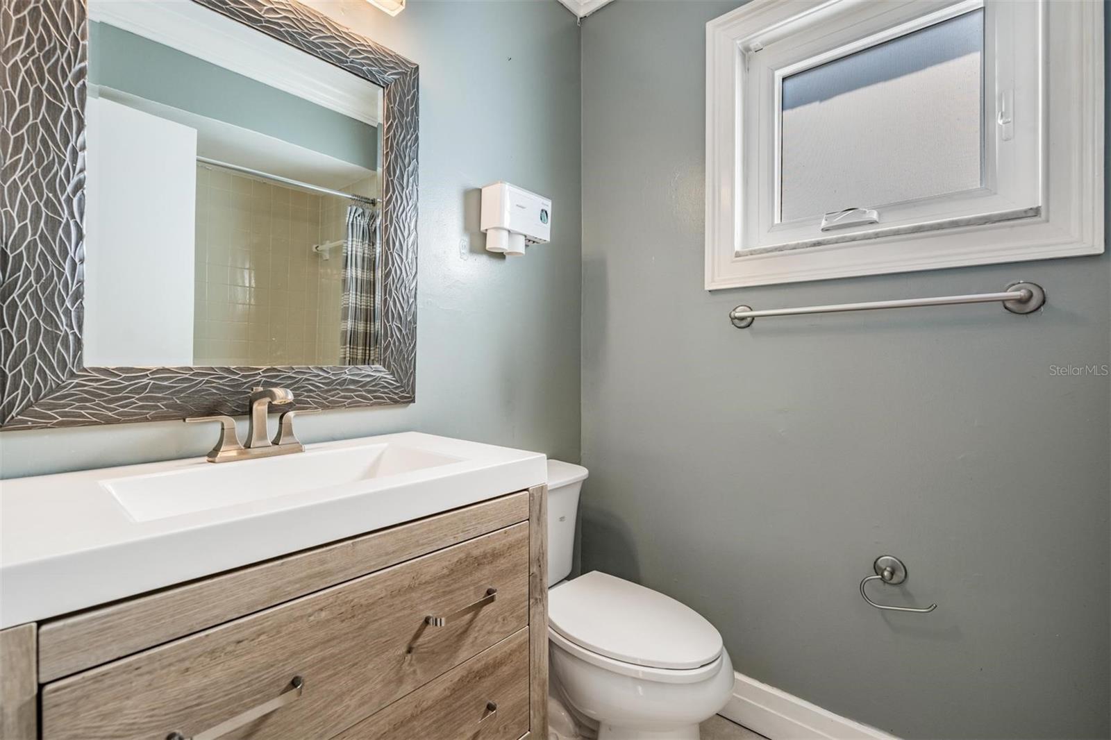 Updated bathroom!  It even has crown molding! (Look at that gorgeous mirror!)