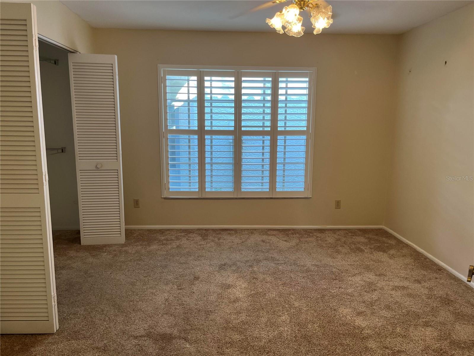 BEDROOM WITH SHUTTERS