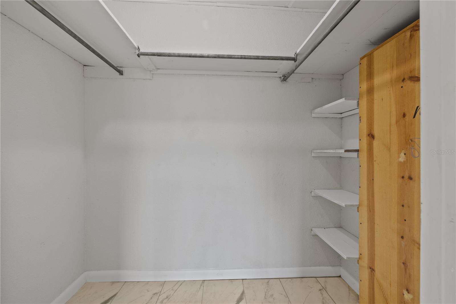 walk-in closet in primary bedroom