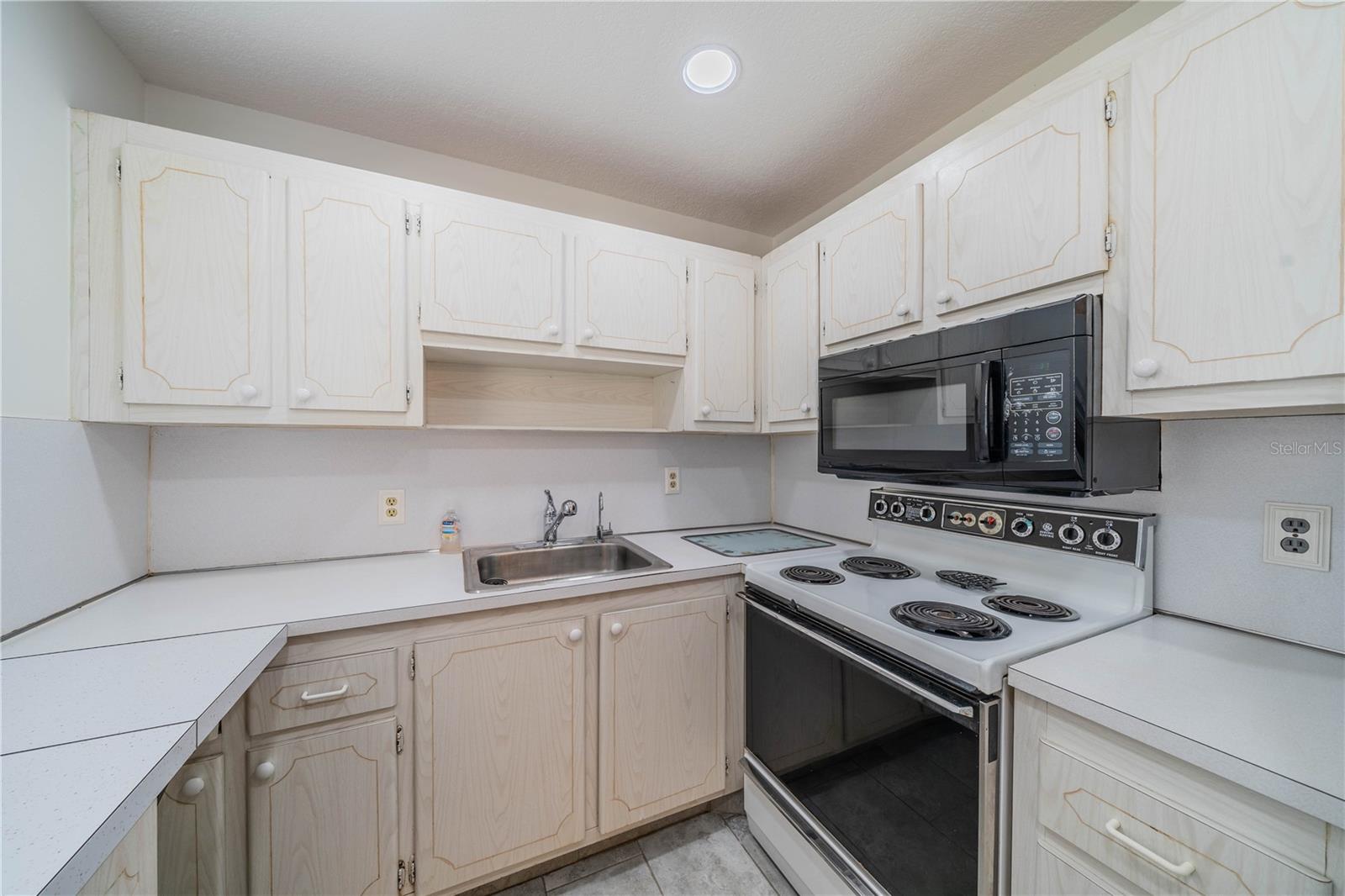 Built-in microwave and lots of cabinets