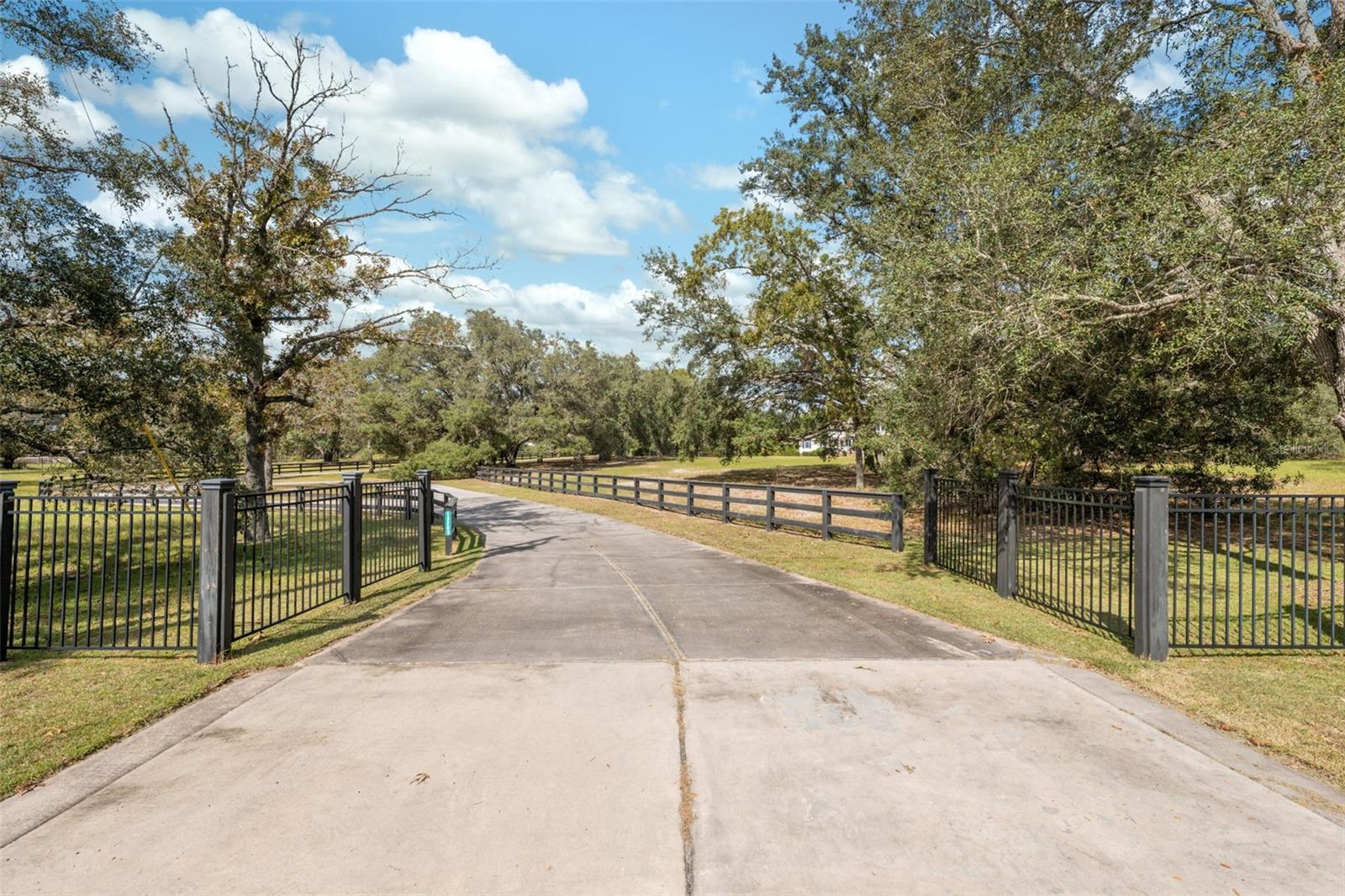 Entryway, circular driveway into residence along the west side of the property, giving a beautiful view of the house.