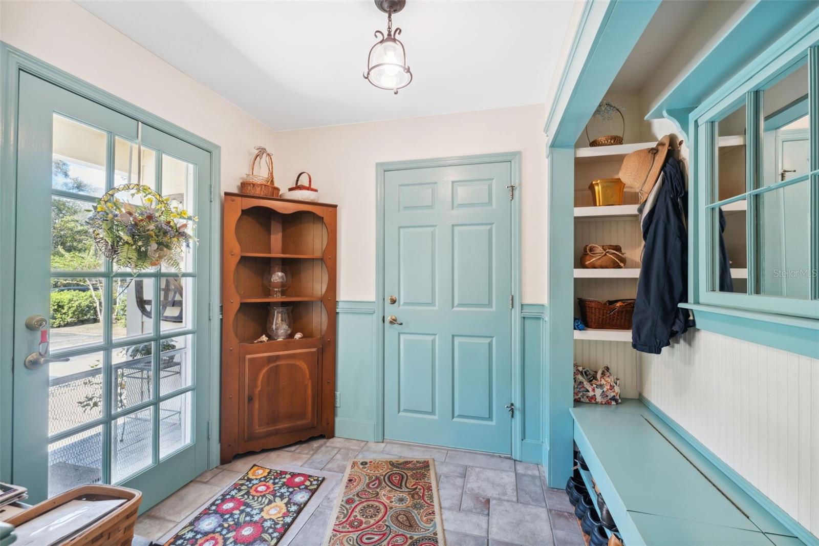 Charming mudroom off from the butler's quarters, leading into the garage and side yard.