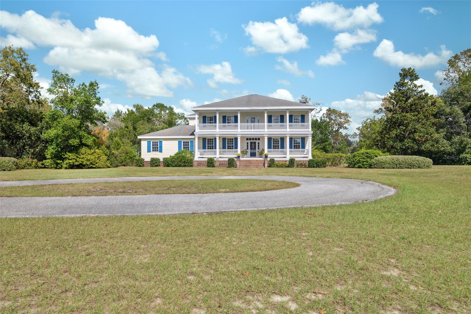 Front view of the house with circular driveway.