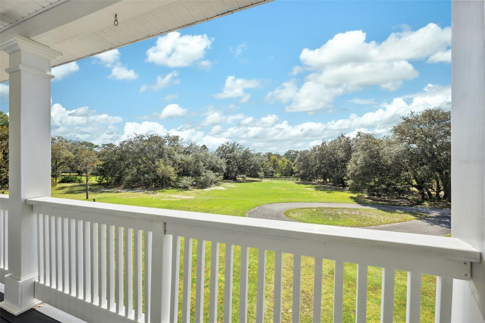 Primary suite and guest room on second level also have balcony access.