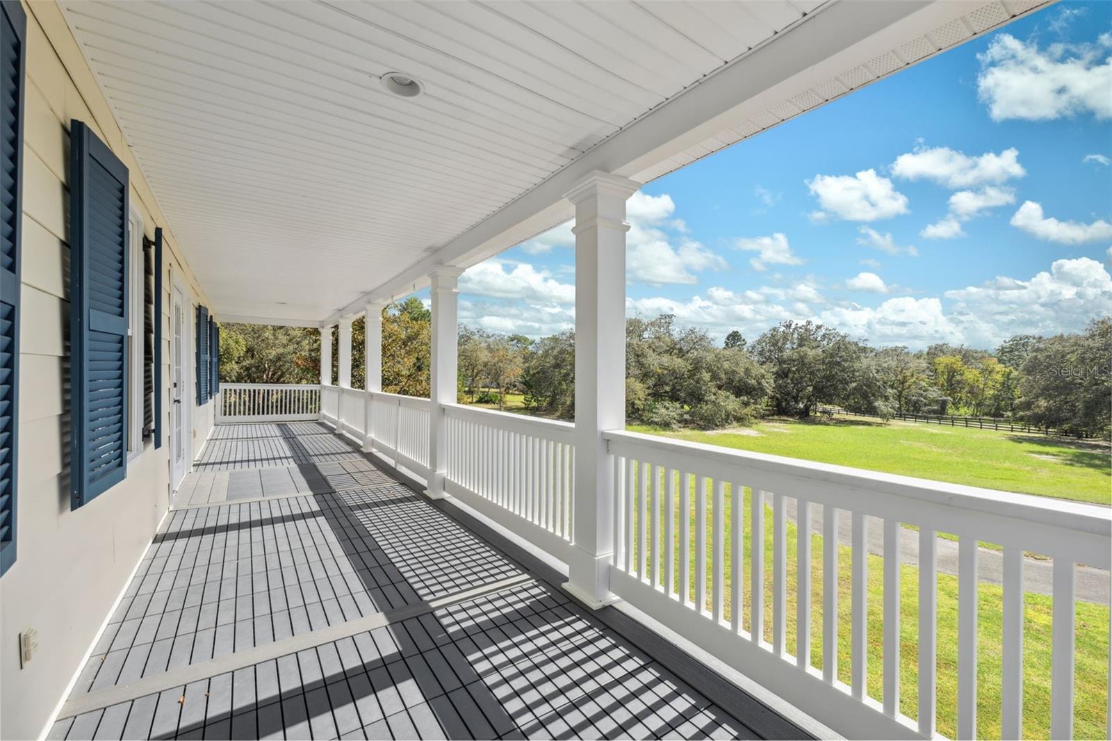 Front porch and balcony run the full length of the home.