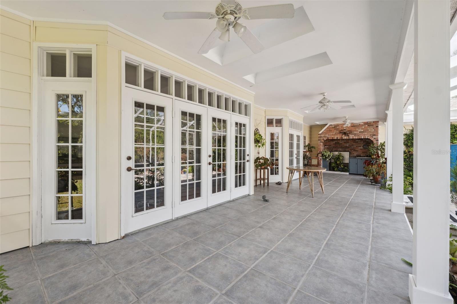 French doors leading from den and kitchen to rear porch. Completely screened.