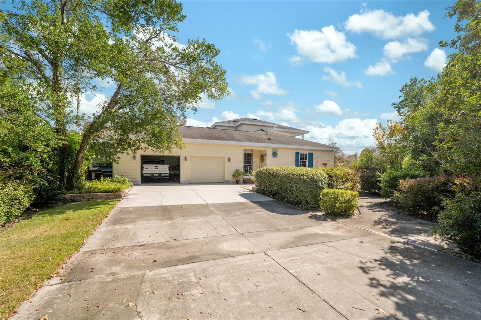 Oversized two car garage attached to main house. Lush landscaping all around.