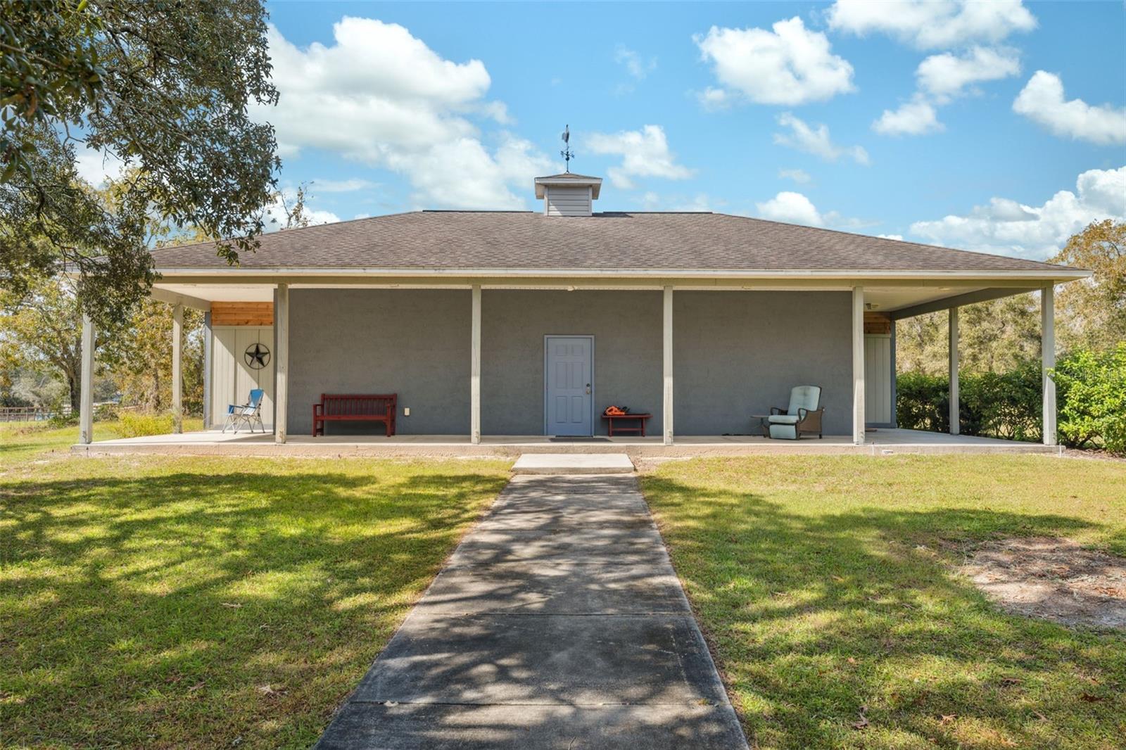 Separate 40 X 24 (960 sq ft) cement block workshop. Has its own electrical service with meter and 225 AMP electrical panel. Also central heat and air with an inside bathroom. This building has so many possibilities.