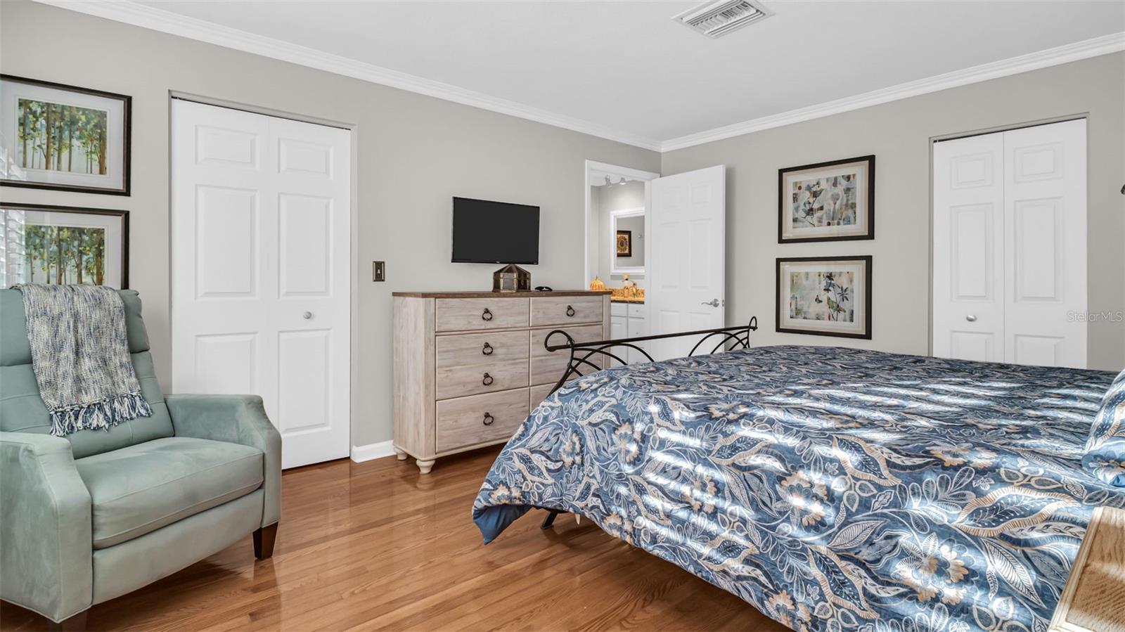 Primary bedroom with a walk in closet for her and another closet for him!