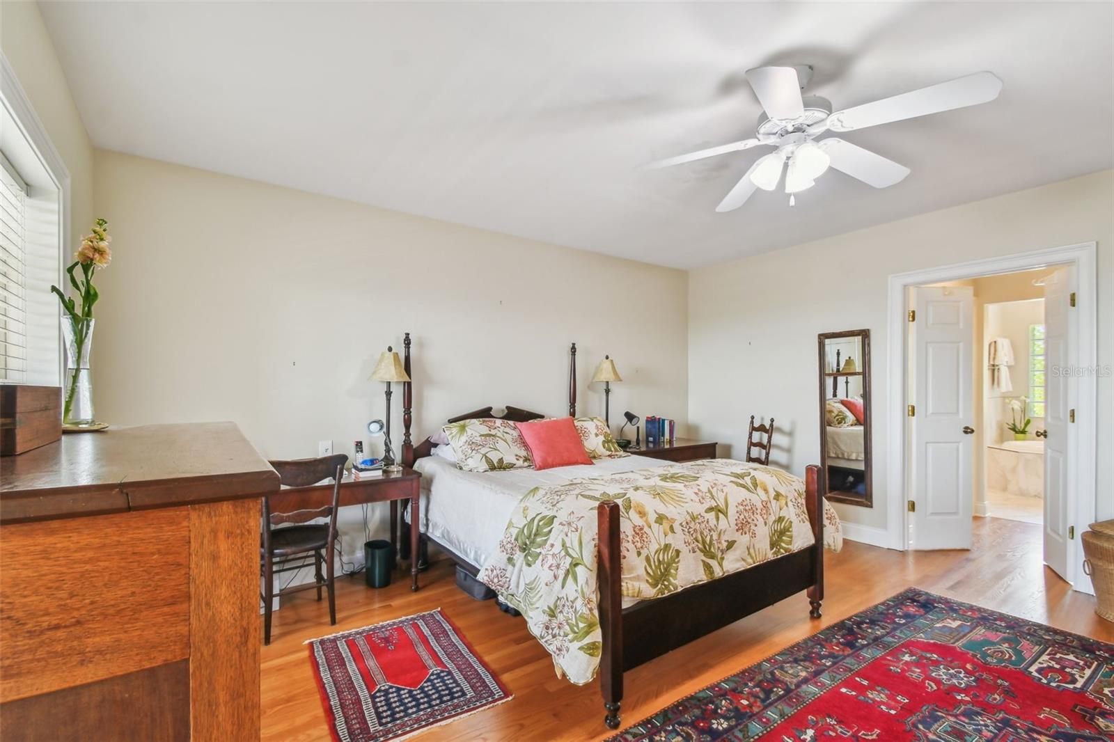 Master Suite Bedroom w/ private deck to the left, 2 Walk In closets on right to EnSuite Bath